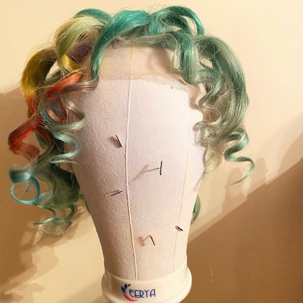 Brand new 10 inch 100% human hair lace front wig. I recurled the wig.